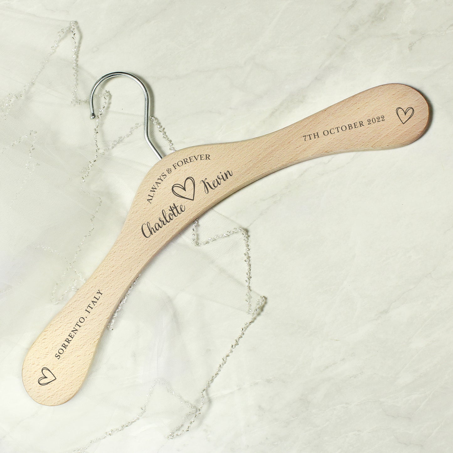 personalised wooden wedding hanger with Bride & Groom's names under the words "Always and Forever" and with a pretty sketched heart between the names. Room for further personalisation on each arm of the hanger.