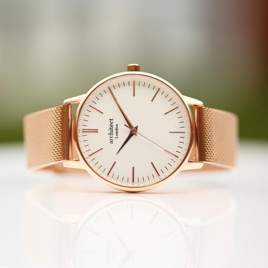 Large white dial with rose gold markers for numerals and rose gold mesh watch strap. Minute, hour and second hand. Architect Watches of London