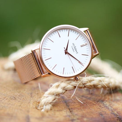 Large white dial with rose gold markers for numerals and rose gold mesh watch strap. Minute, hour and second hand. Architect Watches of London