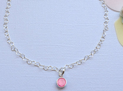 beautiful anklet with heart shaped lines and adorned with a single birthstone of your choice.  Sterling silver.