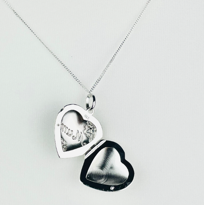 Sterling silver heart shaped locket engraved with the word "Mum" in script and flower decoration. Suspended from a sterling silver chain  open view