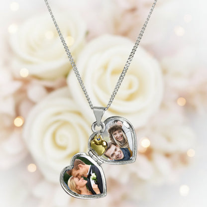 heart shaped locket with a tiny diamante on the front and engraved with a name of your choice in script font. The locket carries a tiny gold plated  heart. The locket can take up to two photos. Sterling silver chain.