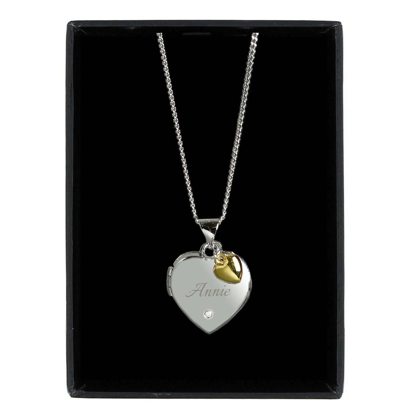 heart shaped locket with a tiny diamond on the front and engraved with a name of your choice in script font. The locket carries a tiny gold plated heart. The locket can take up to two photos. Sterling silver chain.